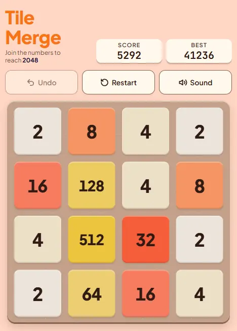 A badly organised Tile Merge board with the 512 tile in the middle of the third row, 128 in the middle of the second row and small tiles scattered between them, every cell full